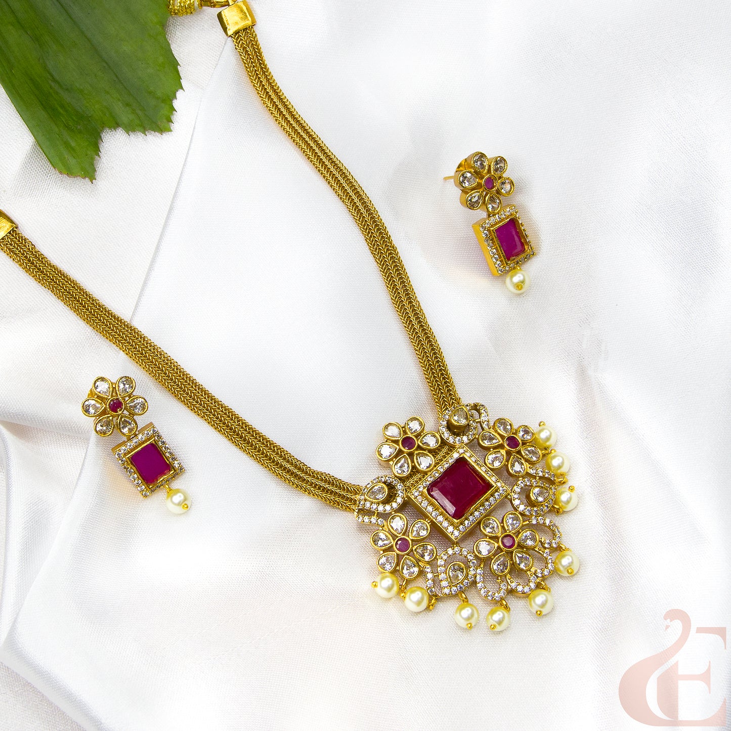 Top left side view of AD_Ruby_Studded Antique Necklace_with matching earrings