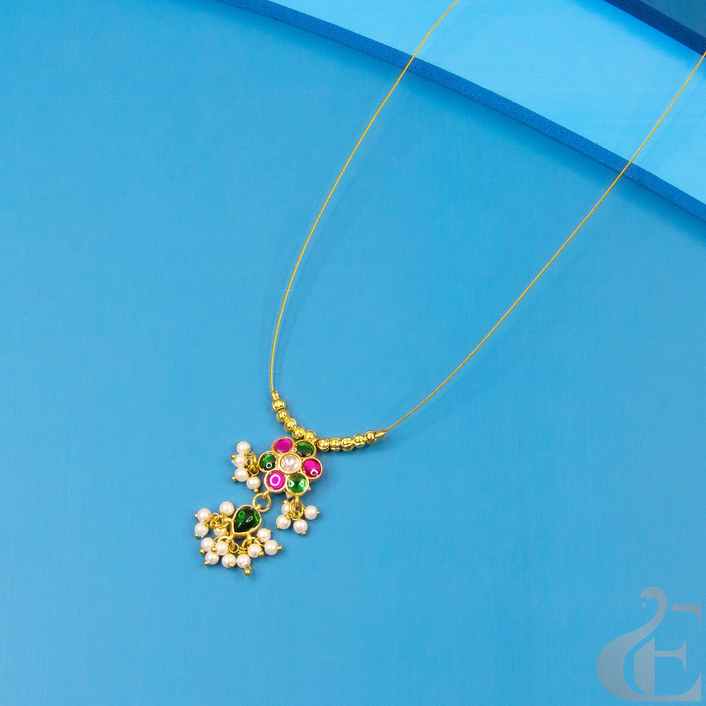 Top view of Anti-Tarnish Invisible Chain Necklace Green Ruby White Stone