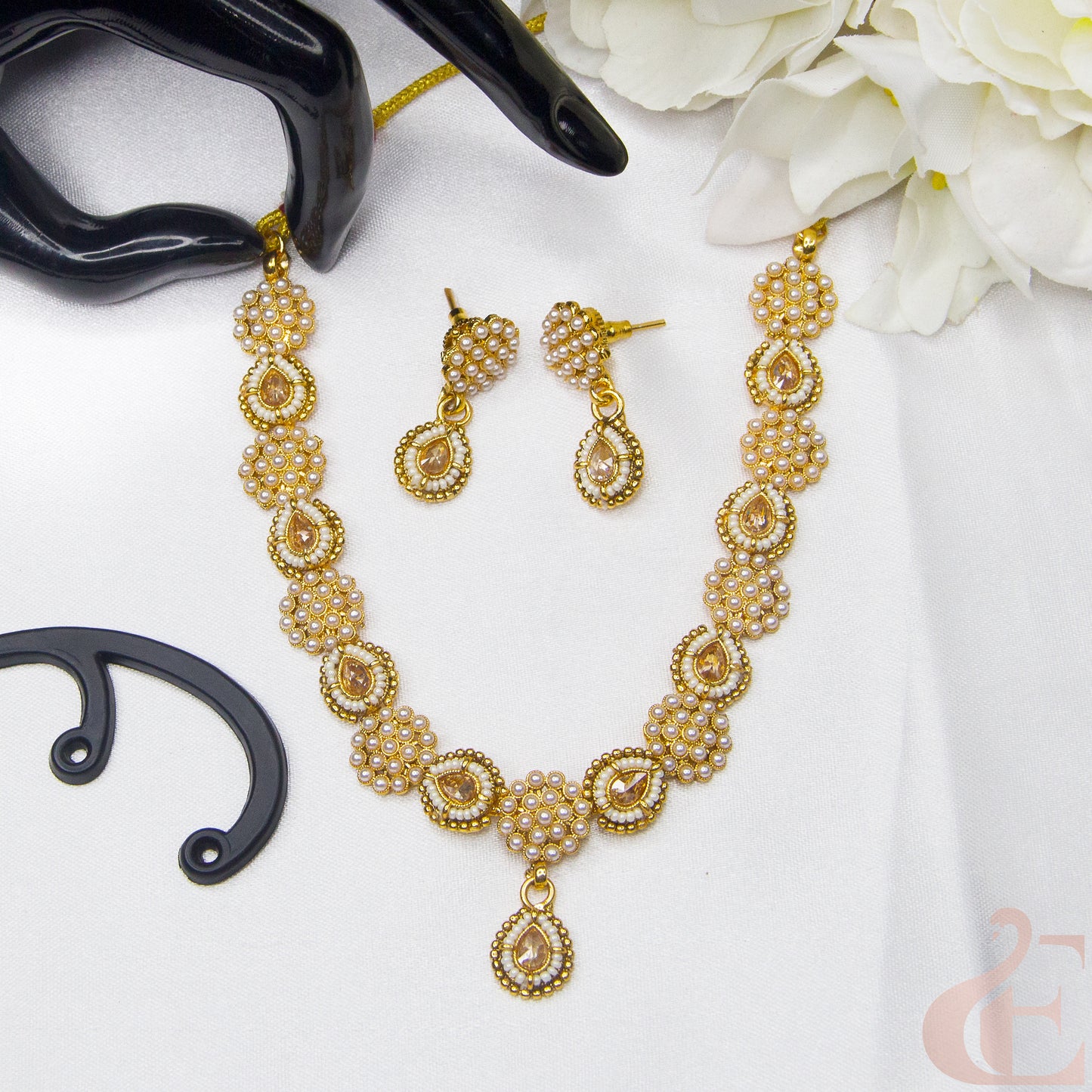 Top view of Antique Design Pearl Necklace & Earrings , white stones