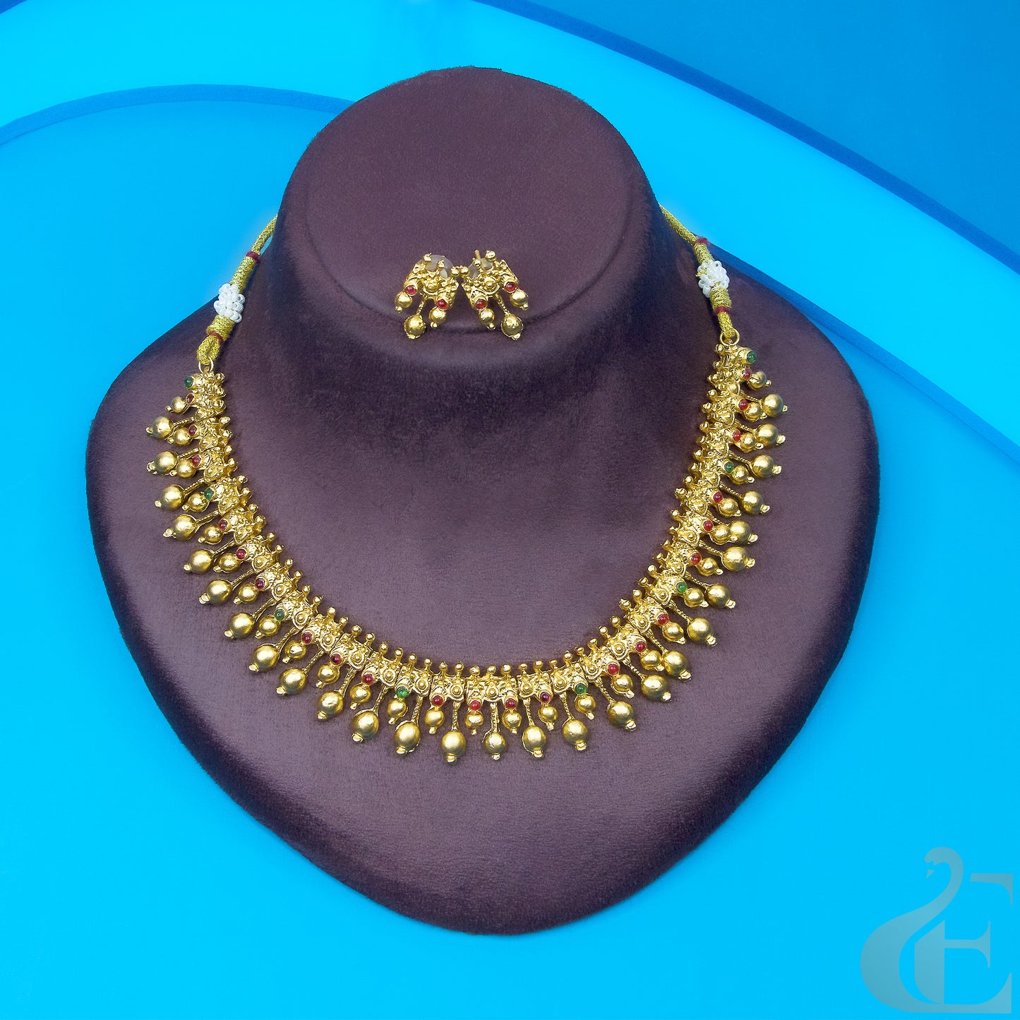 Top view of Antique Necklace & Earrings Small ruby green stones