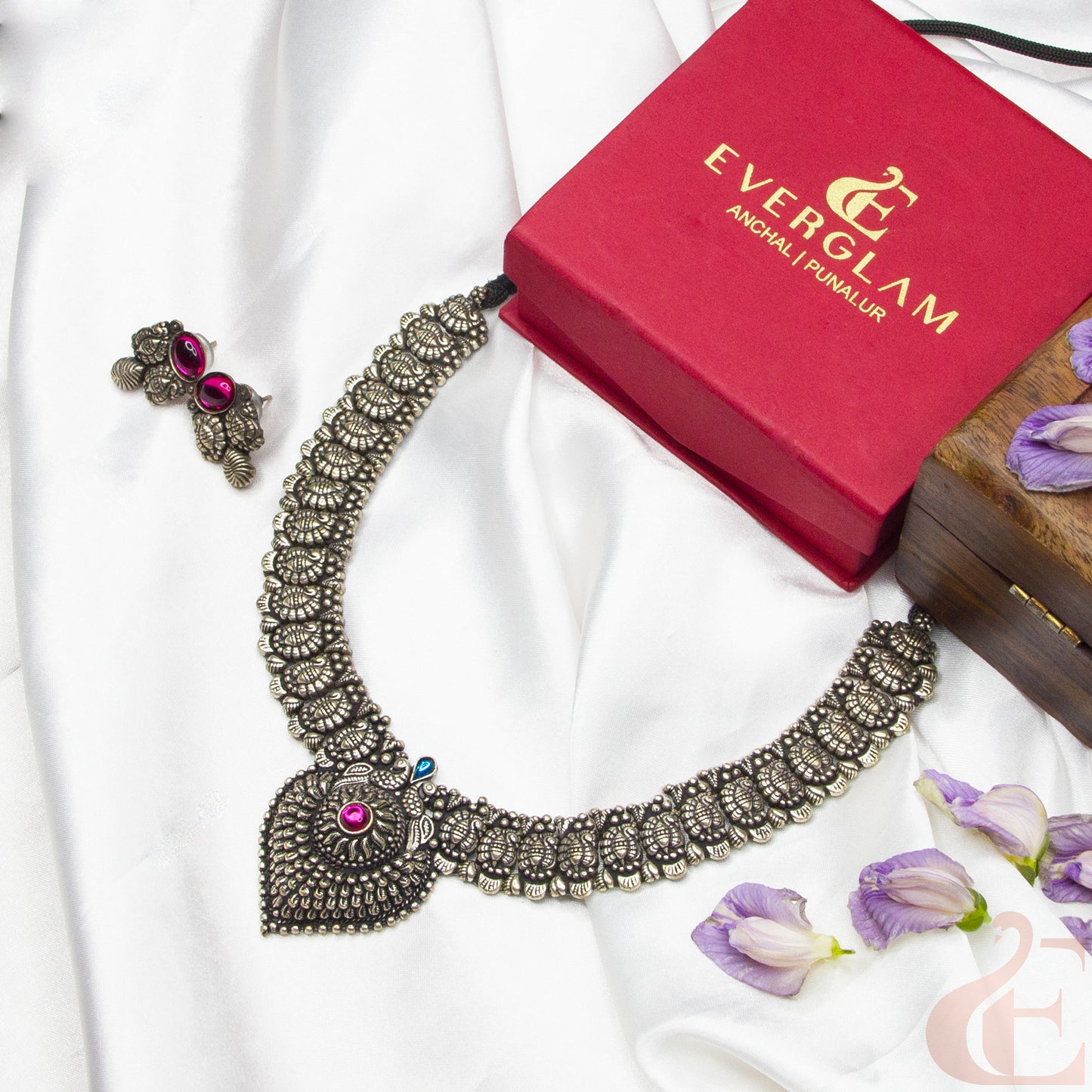 Top view of German Silver Replica Choker & Earrings ruby blue stones