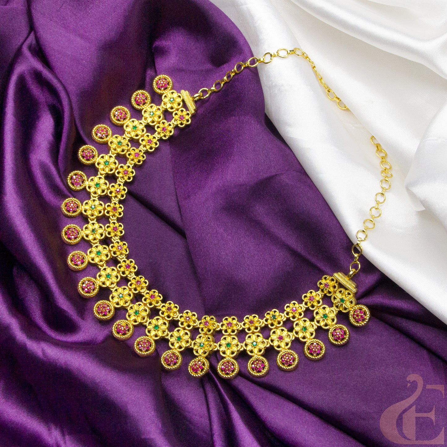 Top view of Gold Finish AD Stone Necklace ruby green stones