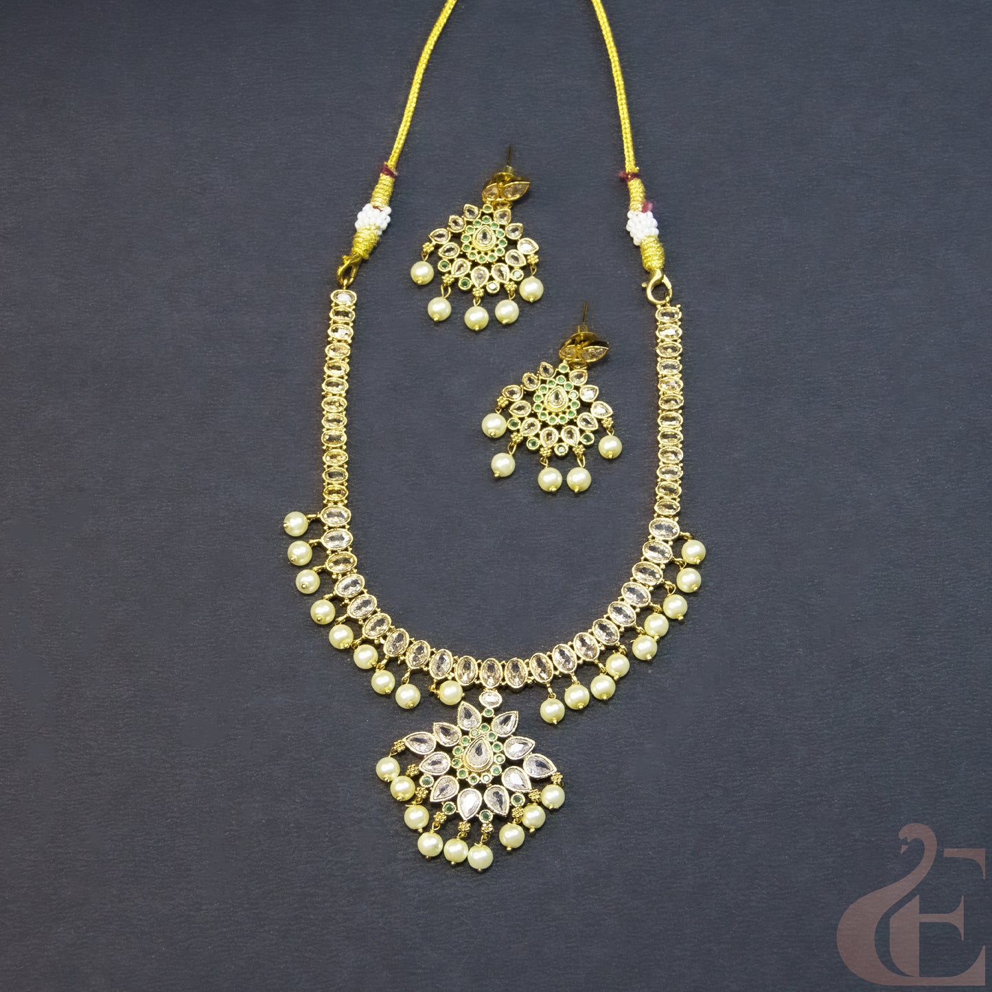Top view of Gold Plated AD Necklace & Earrings white stones