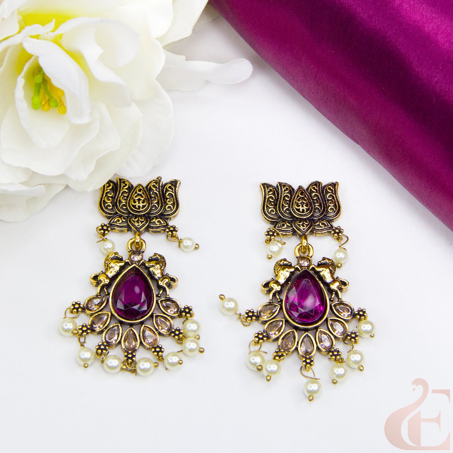 Top view of Mehndi finish lotus & horse designed earrings Rani Pink Stone