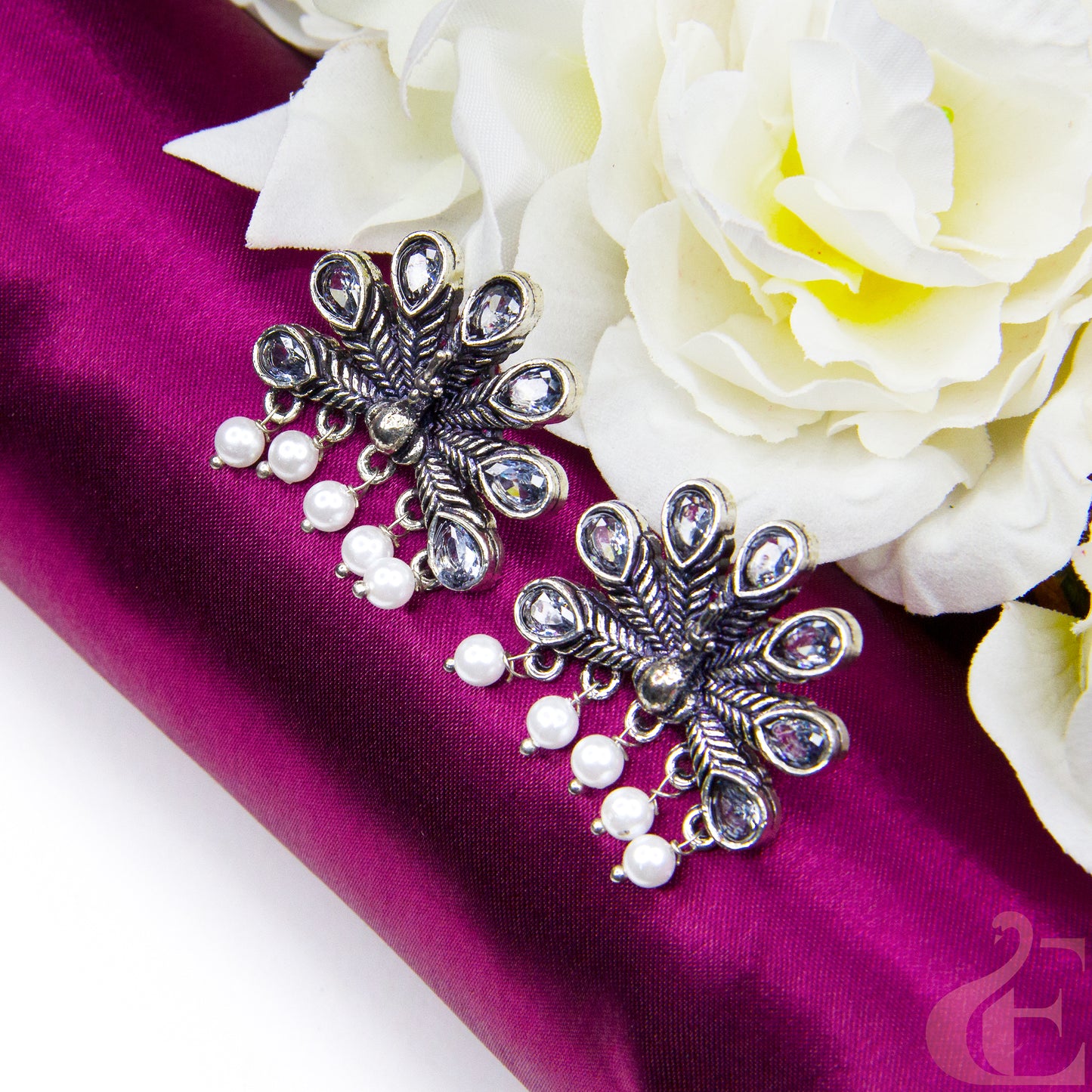 Top view of Oxidised Peacock White Color Earrings