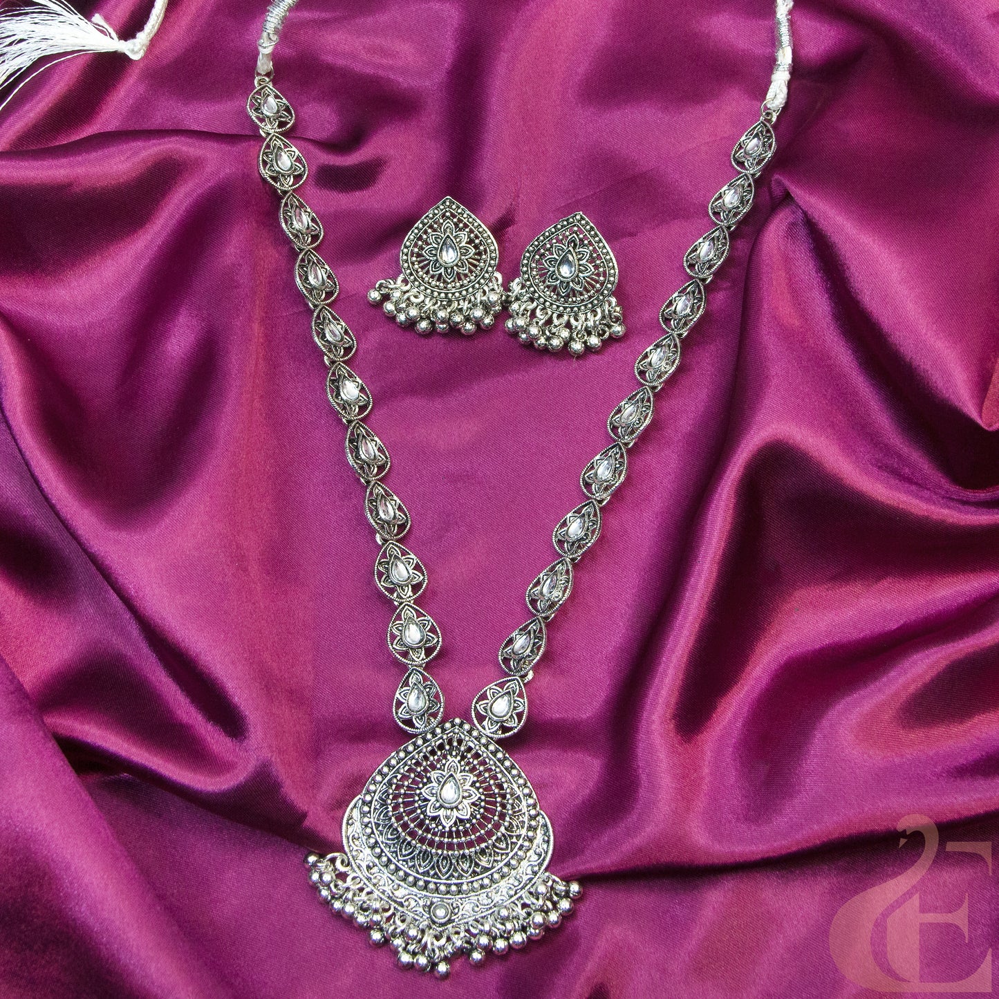 Top view of Oxidized Long Necklace & Earrings white stones