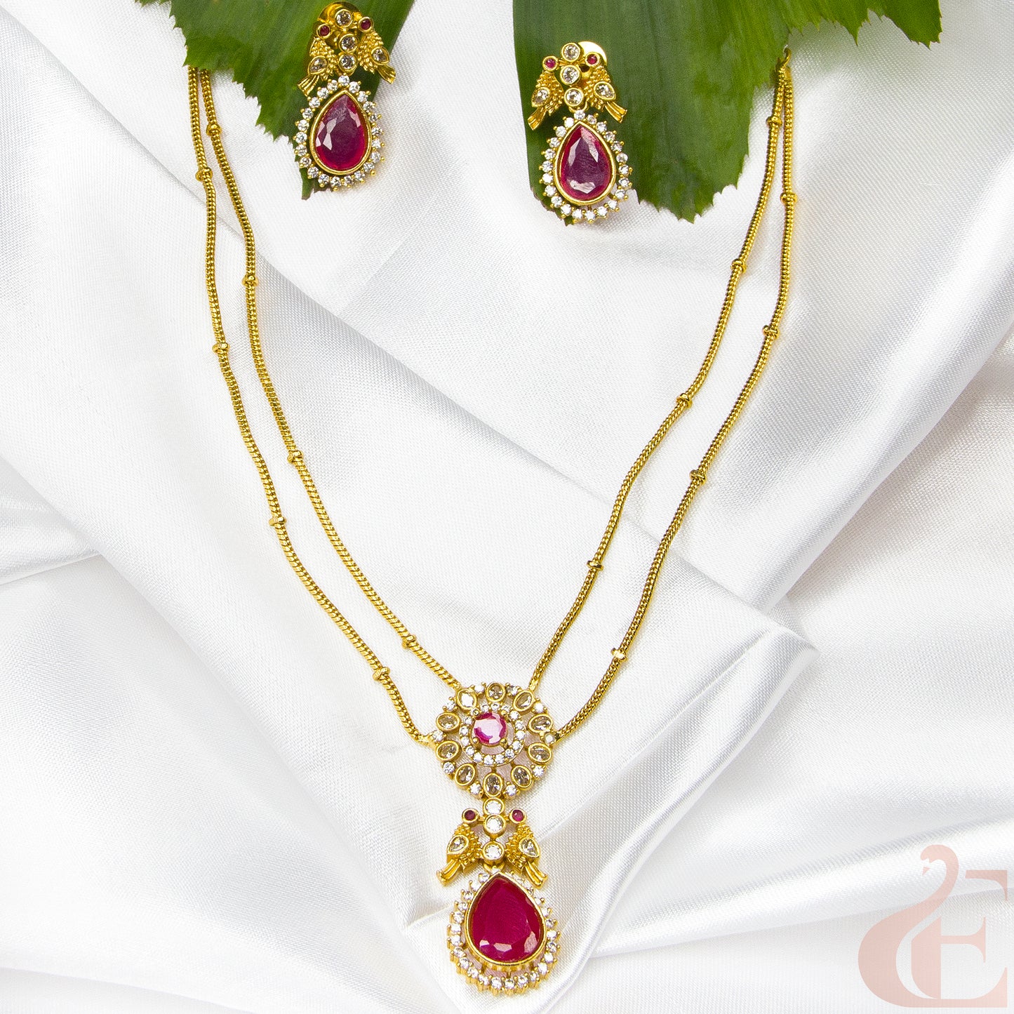 Top view of Premium AD stone Pendant Chain Neckpiece & Earrings , ruby stones