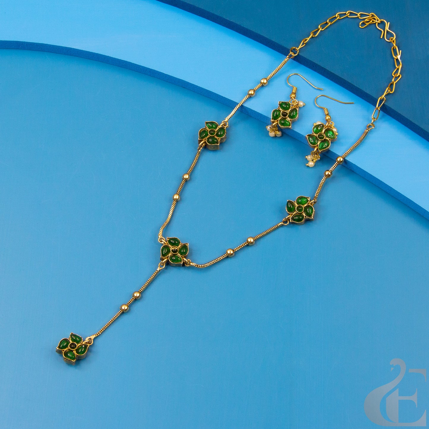 Top view of Reversible Matte Finish Necklace With Hook Earrings Ruby Green Stones