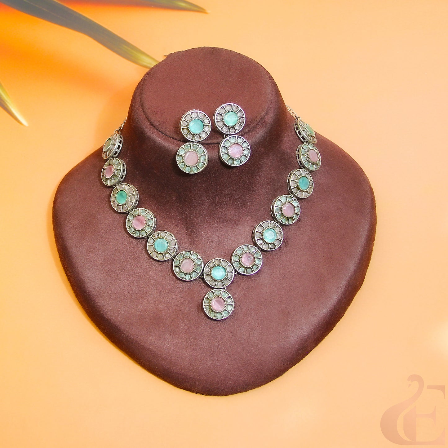 Top view of Silver Replica AD Stone Necklace & Earrings Pista green and pink stones