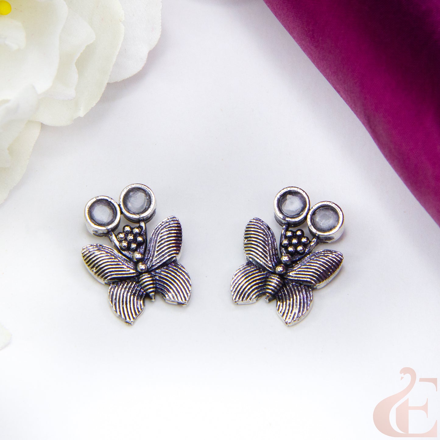 Top view of Butterfly Oxidised Stud Earrings White stone