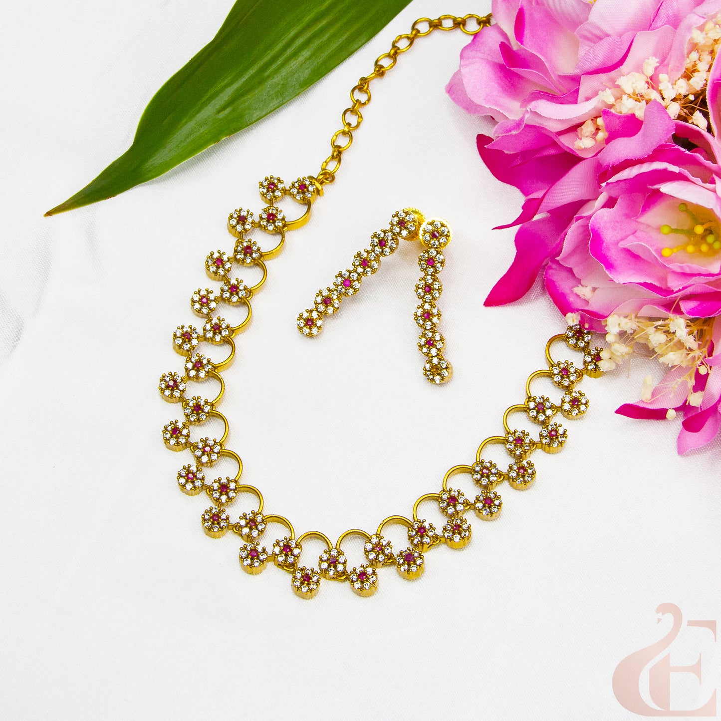 Top view of AD Stone Gold Plated Necklace  & Earrings , ruby white stones 