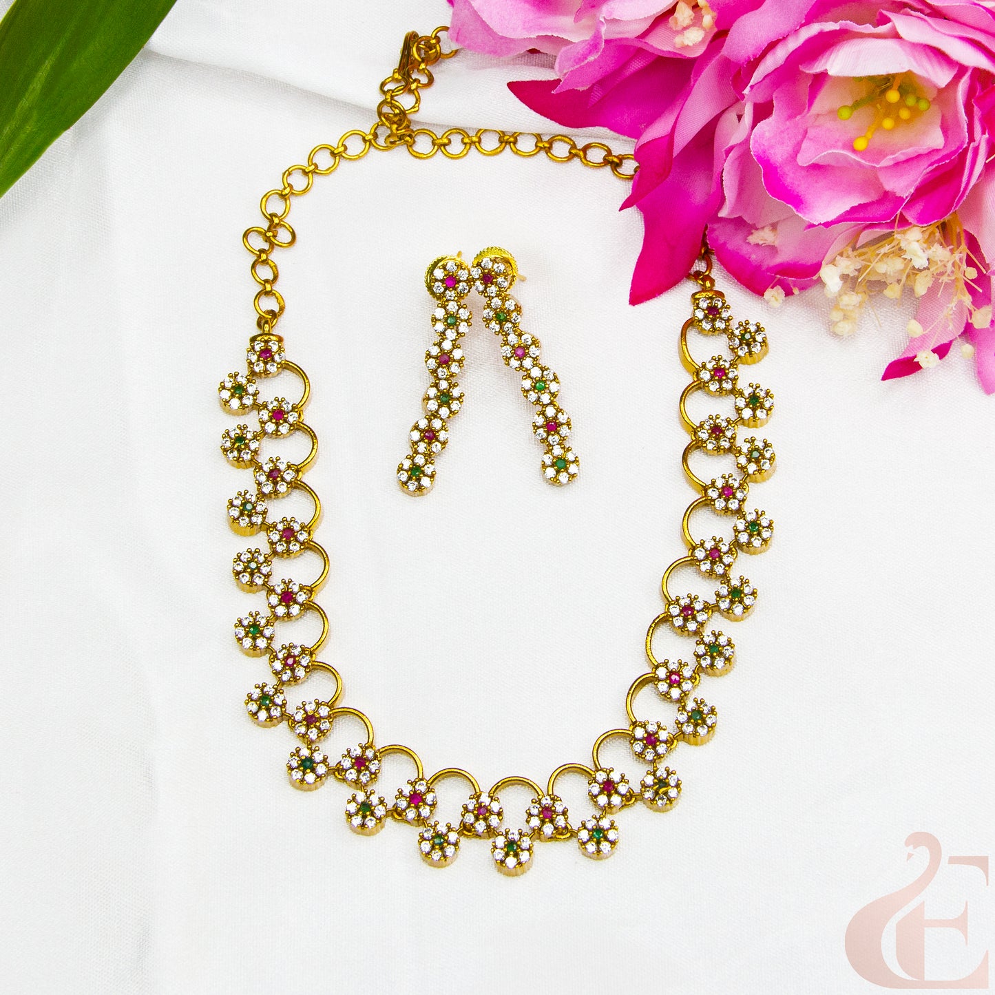 Top view of AD Stone Gold Plated Necklace  & Earrings , ruby green white stones