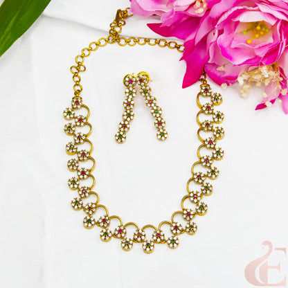 Top view of AD Stone Gold Plated Necklace  & Earrings , ruby green white stones