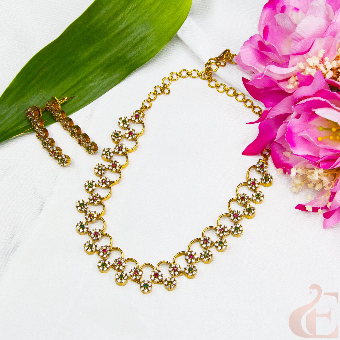 Top view of AD Stone Gold Plated Necklace  & Earrings , ruby green white stones 