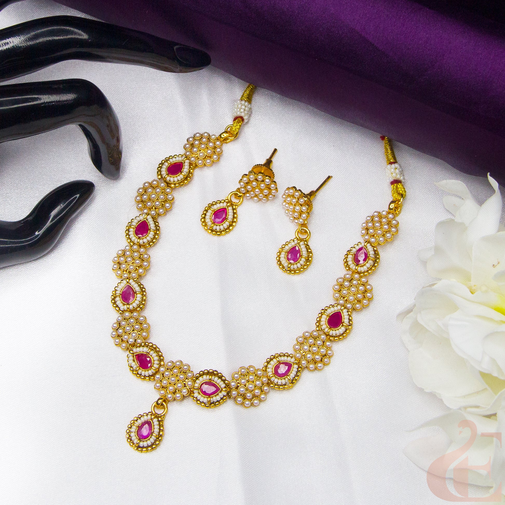 Top view of Antique Design Pearl Necklace & Earrings , Ruby stones 