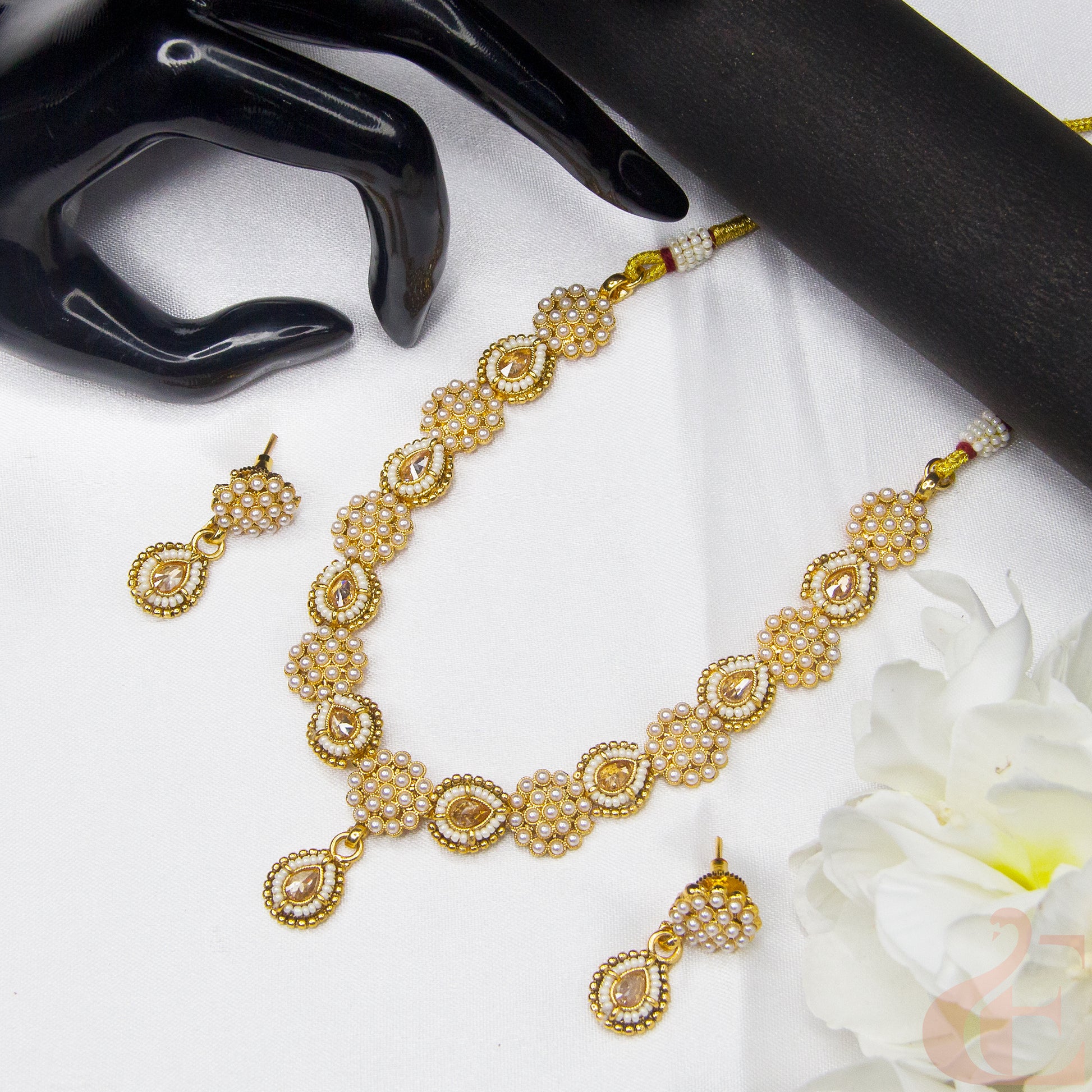 Top view of Antique Design Pearl Necklace & Earrings , white stones 