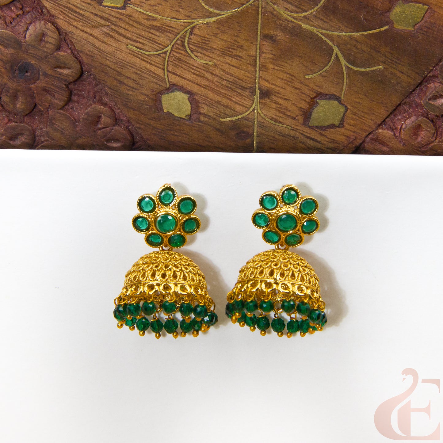 Front view ofAntique Earring Light weight Premium Jhumka  Green Stone