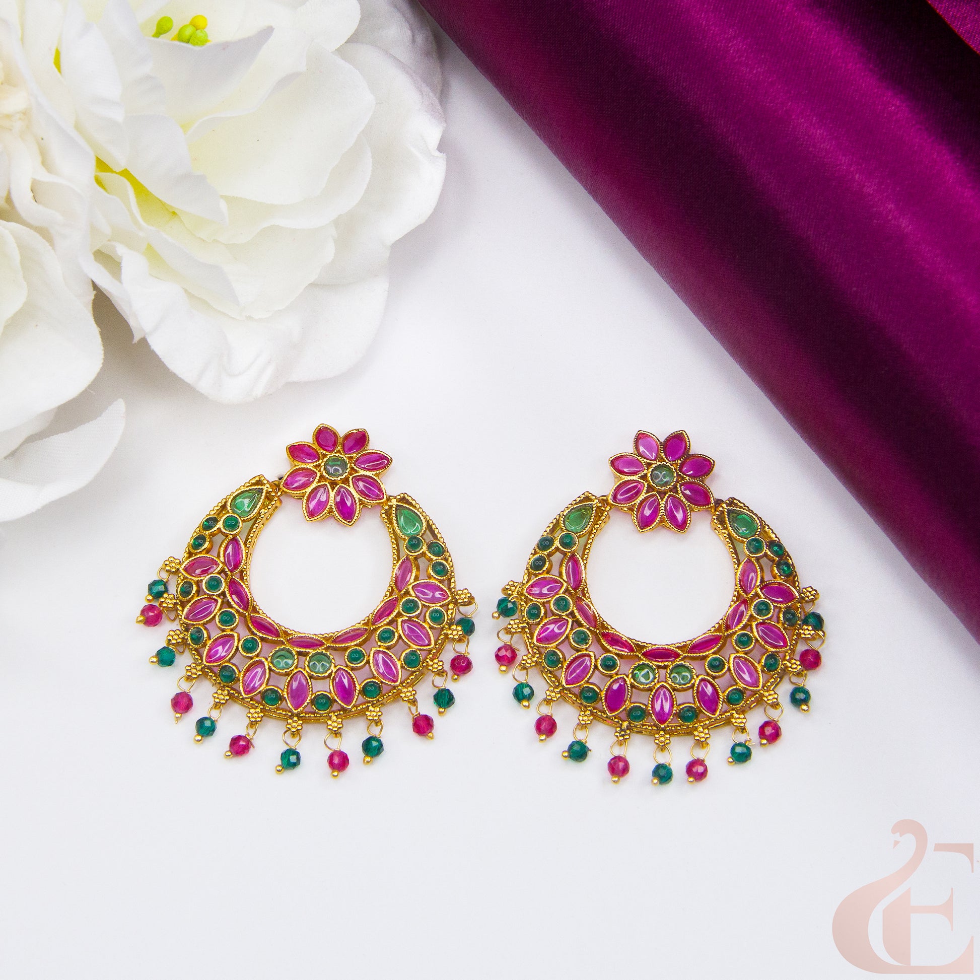 Top view of Antique Light weight Premium Earrings , ruby green stones 