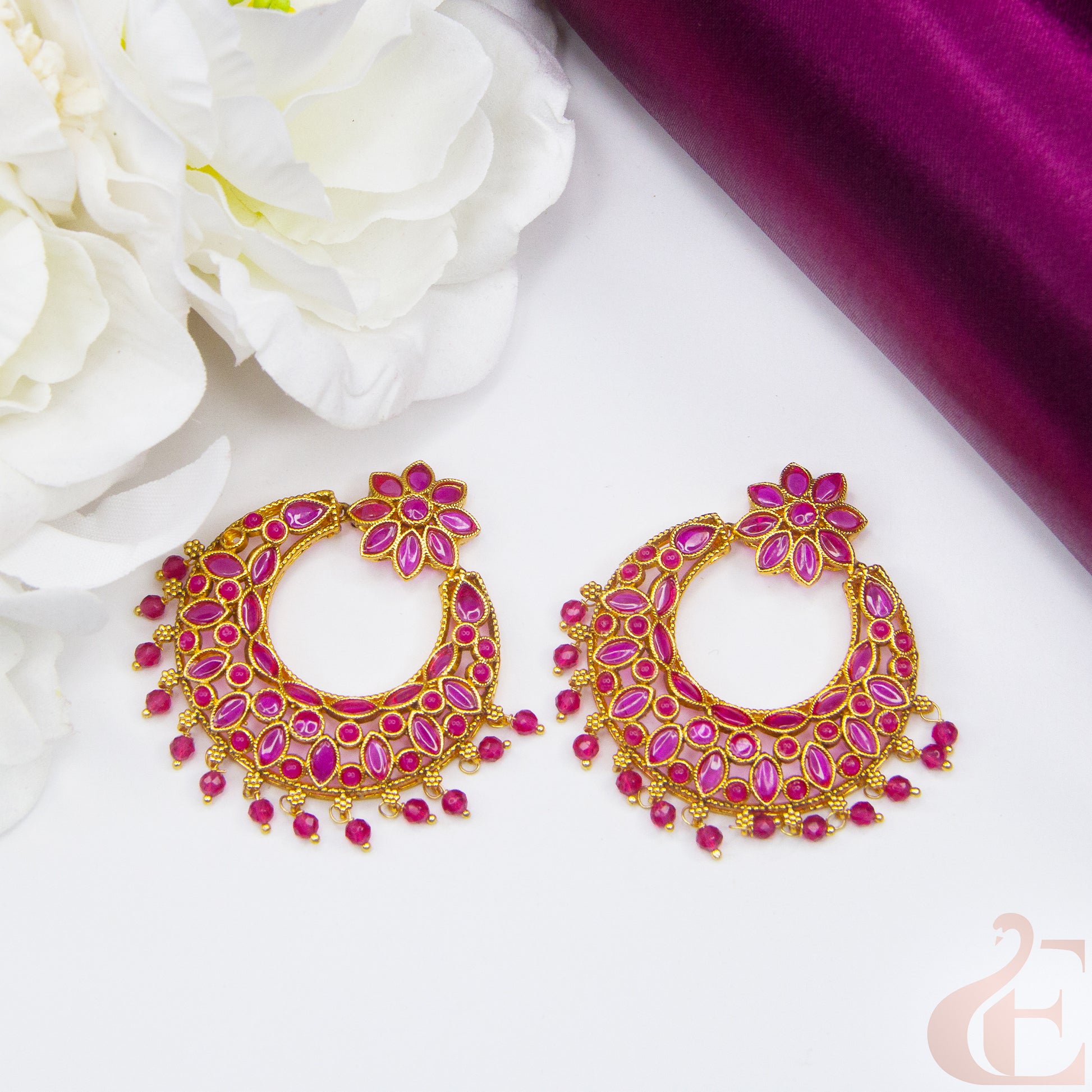 Side angle Top view of Antique Light weight Premium Earrings , ruby stones 