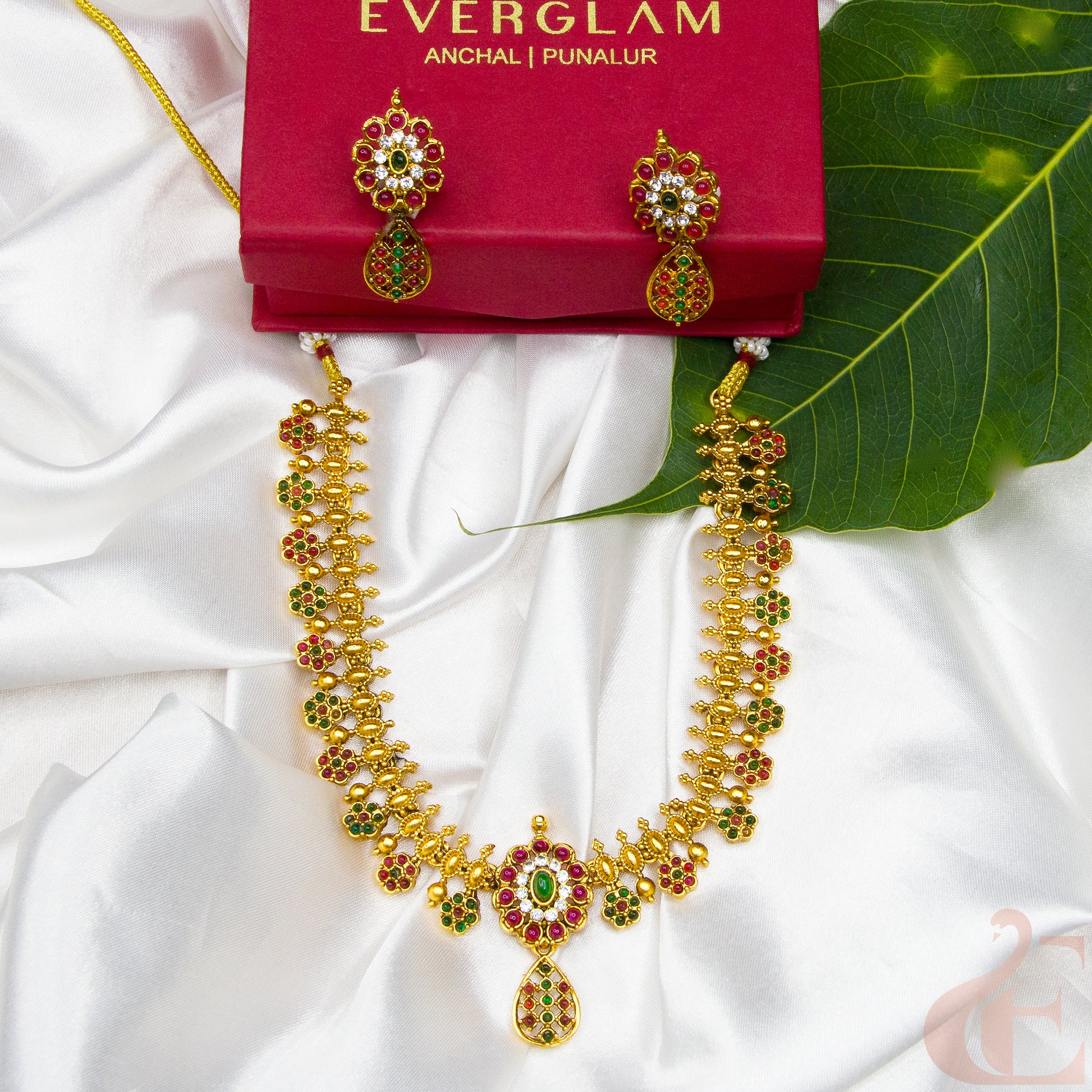 Top view of Antique Necklace & Earrings Ruby green white stones 
