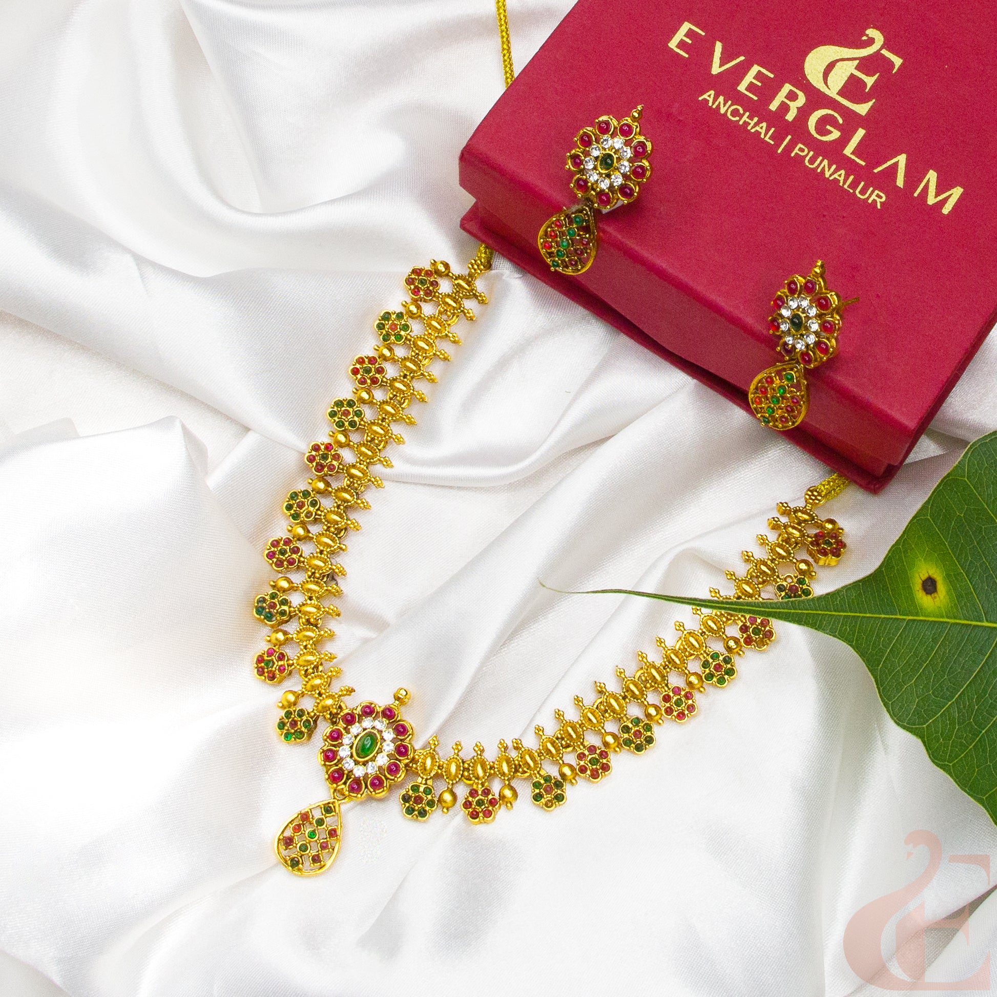Side angle Top view of Antique Necklace & Earrings Ruby green white stones 