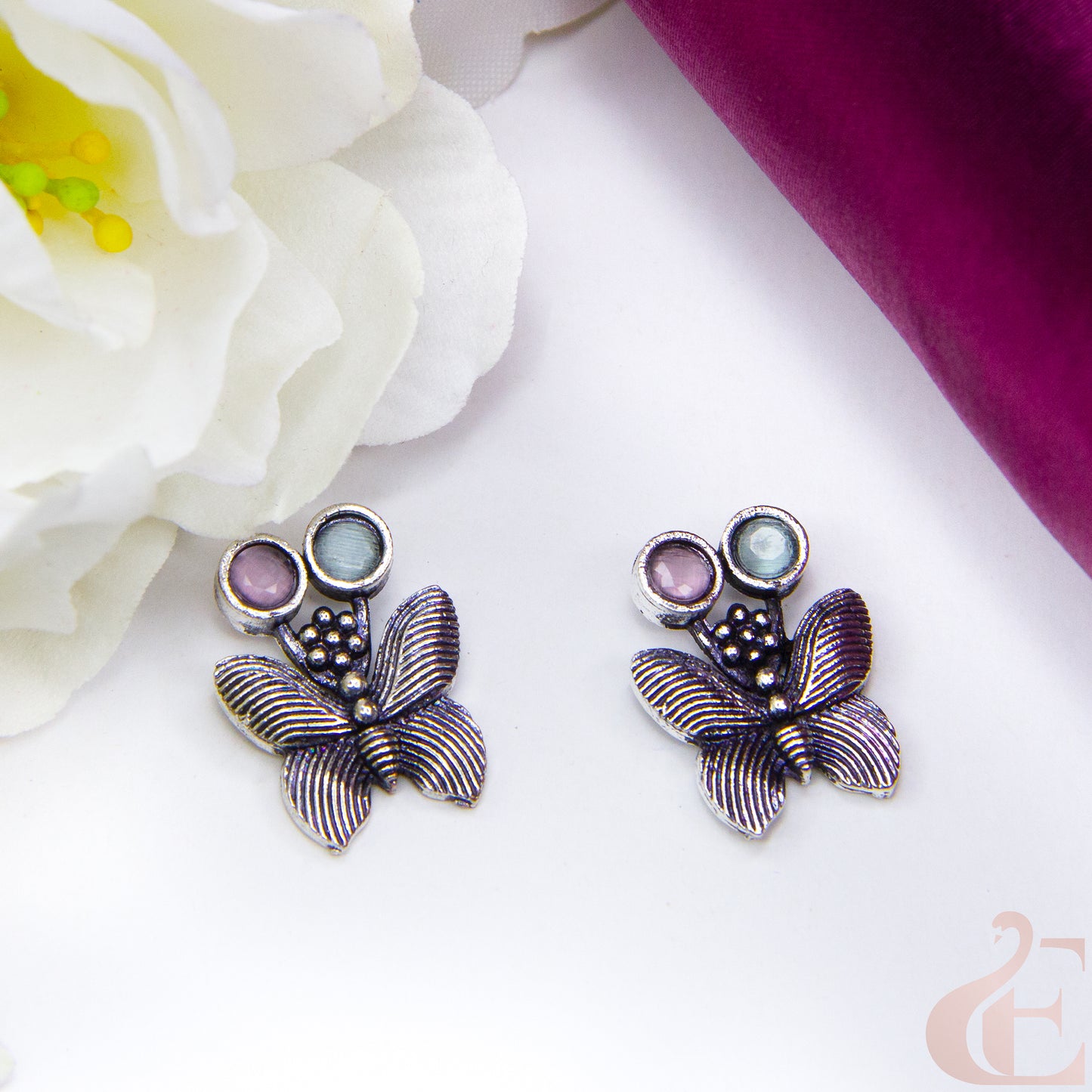 Top view of Butterfly Oxidised Stud Earrings Light Pink Blue stone.
