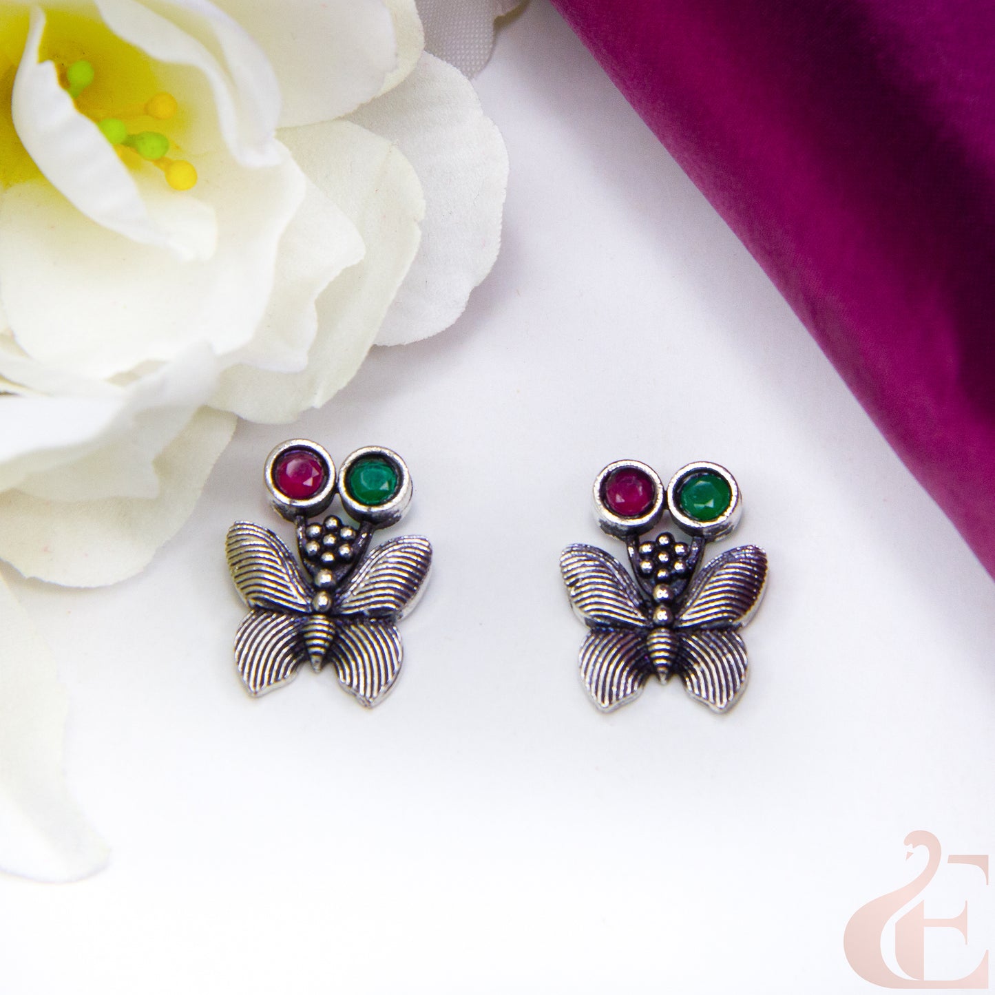 Top view of Butterfly Oxidised Stud Earrings Ruby green stone 