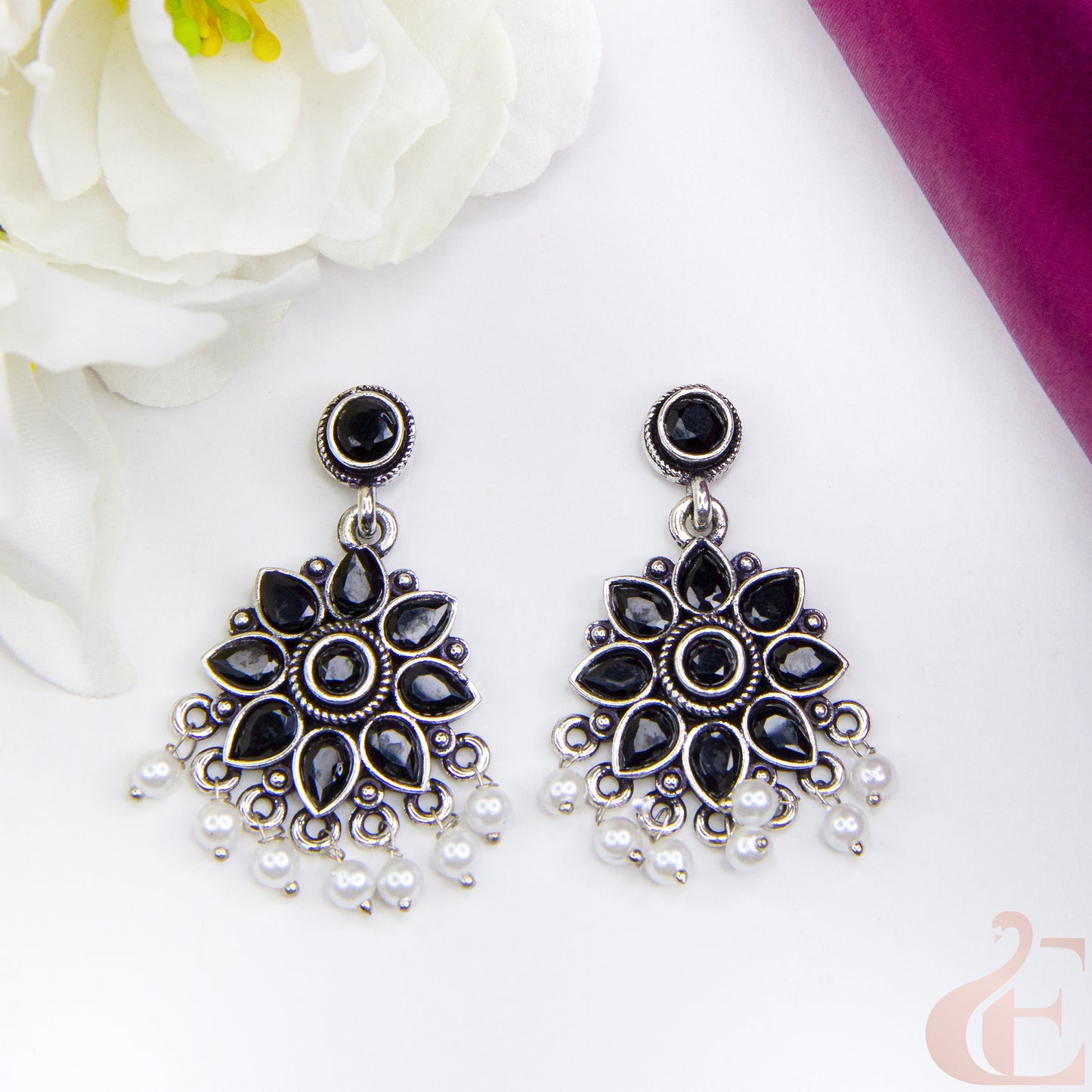 Top view of Elegant Oxidised Silver Floral Earrings Black Stone 