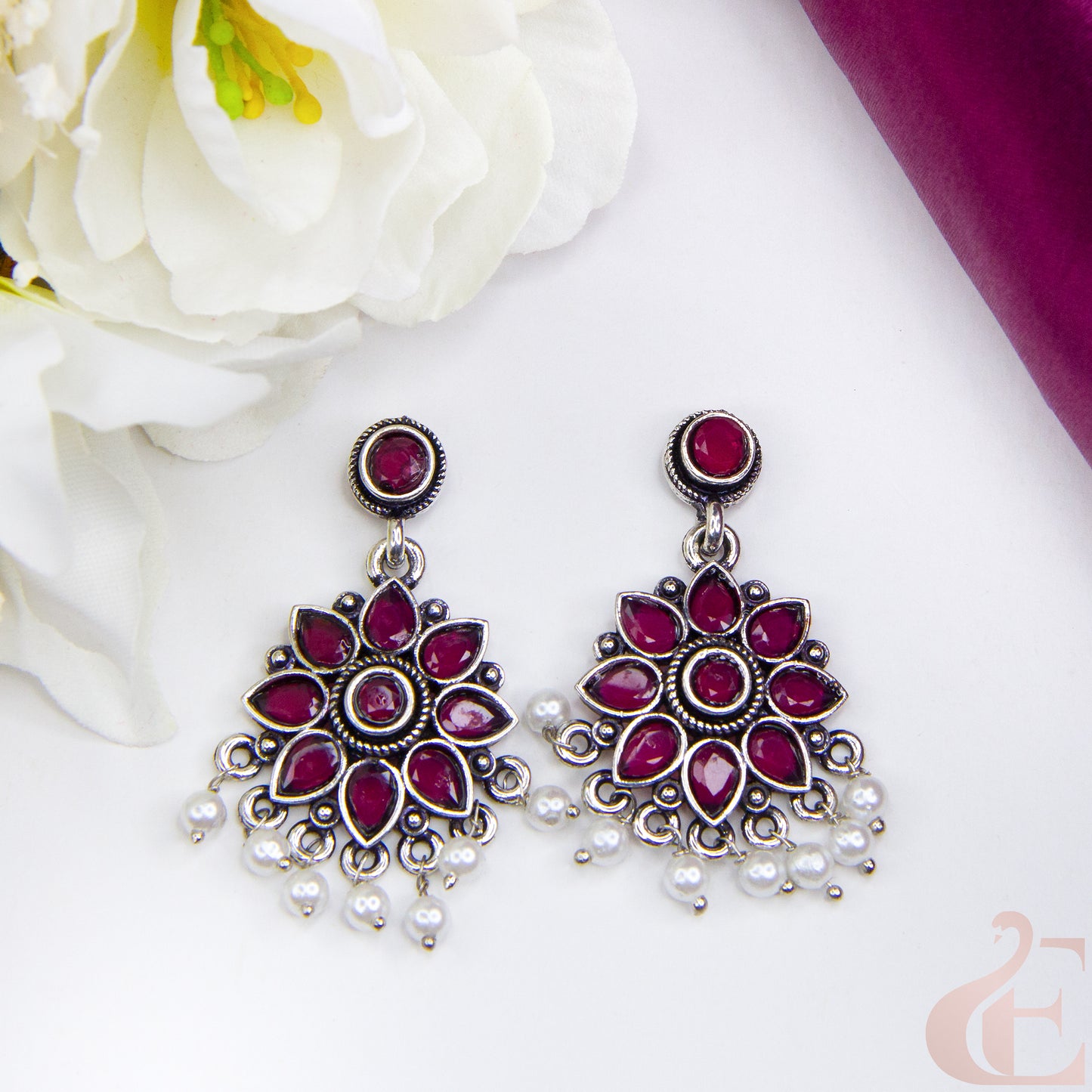 Top view of Elegant Oxidised Silver Floral Earrings Rani Pink Stone 