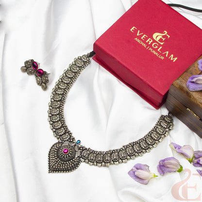 Top view of German Silver Replica Choker & Earrings ruby blue stones 