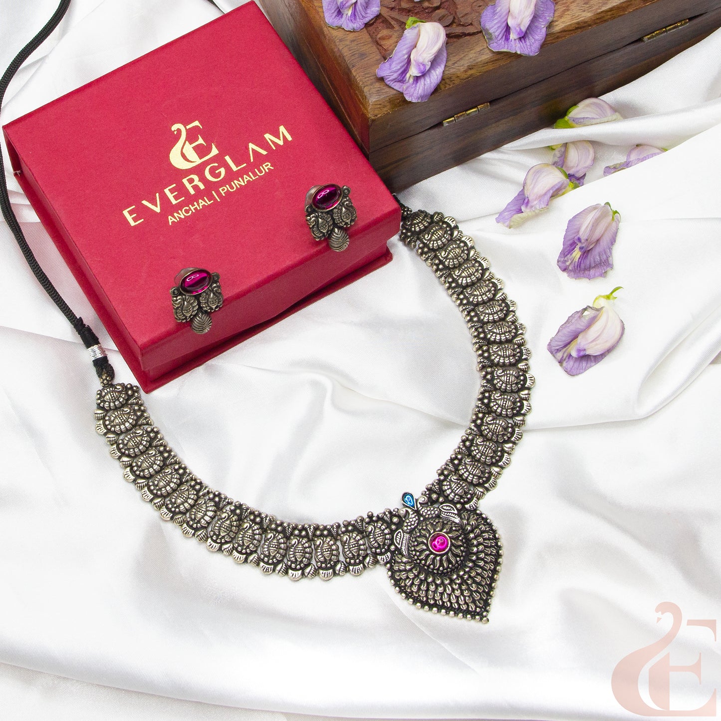 Top view of German Silver Replica Choker & Earrings ruby blue stones 