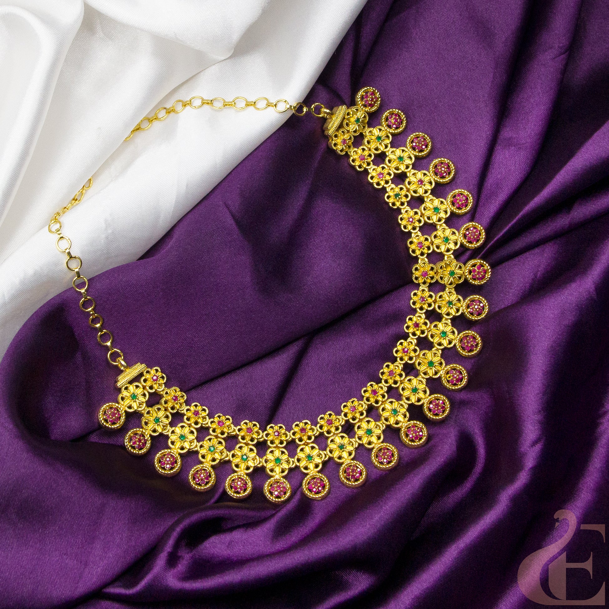 Top view of Gold Finish AD Stone Necklace Ruby green stones 
