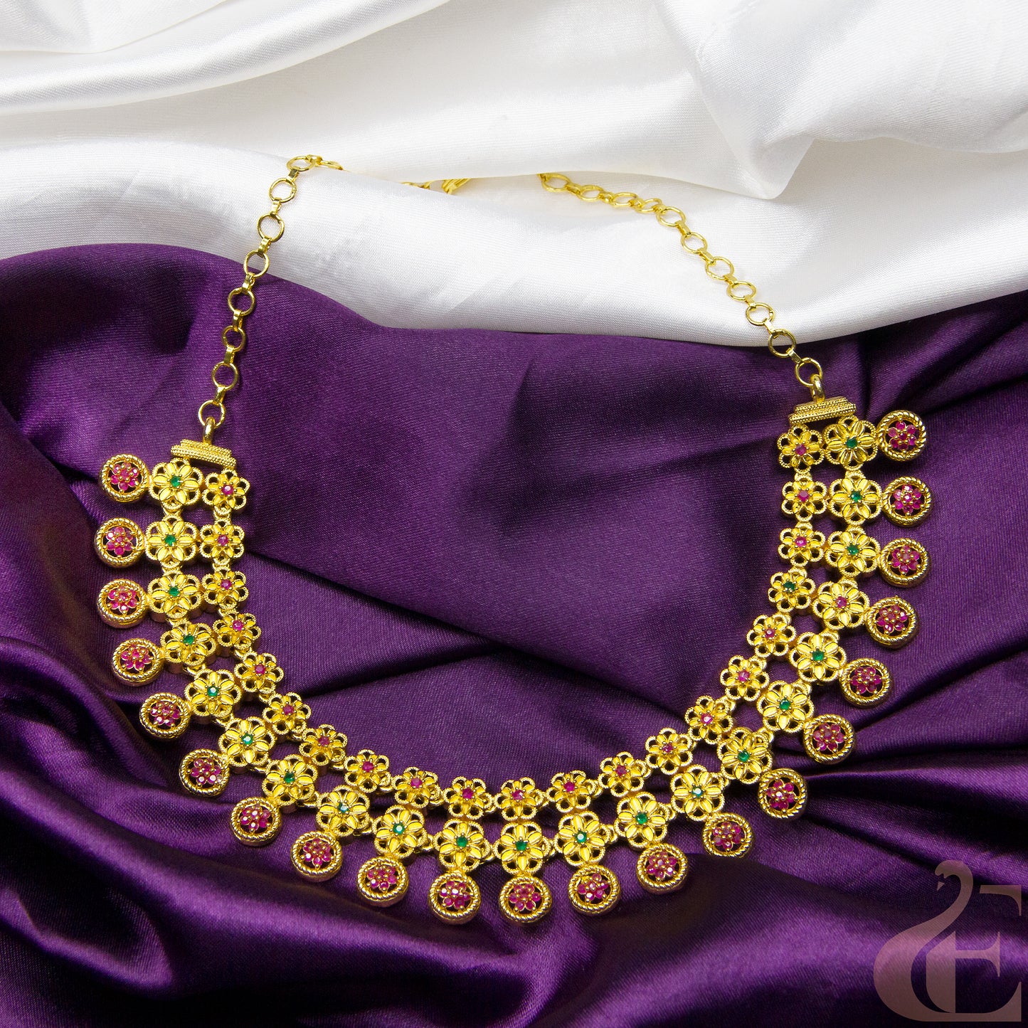 Top view of Gold Finish AD Stone Necklace ruby green stones 