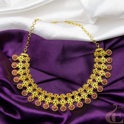 Top view of Gold Finish AD Stone Necklace ruby green stones 