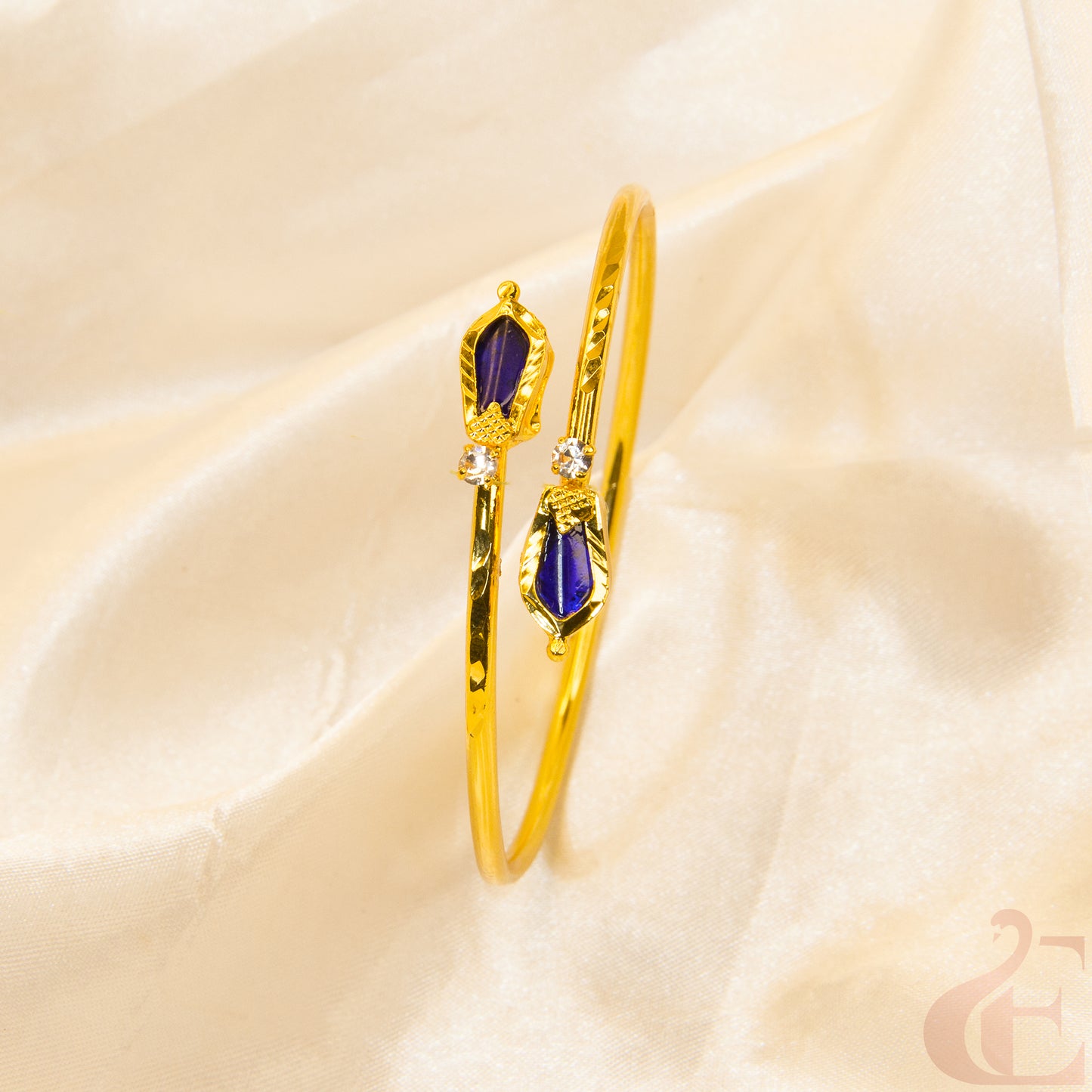 Top view of Gold nagapadam Kerala style kada Blue white stones