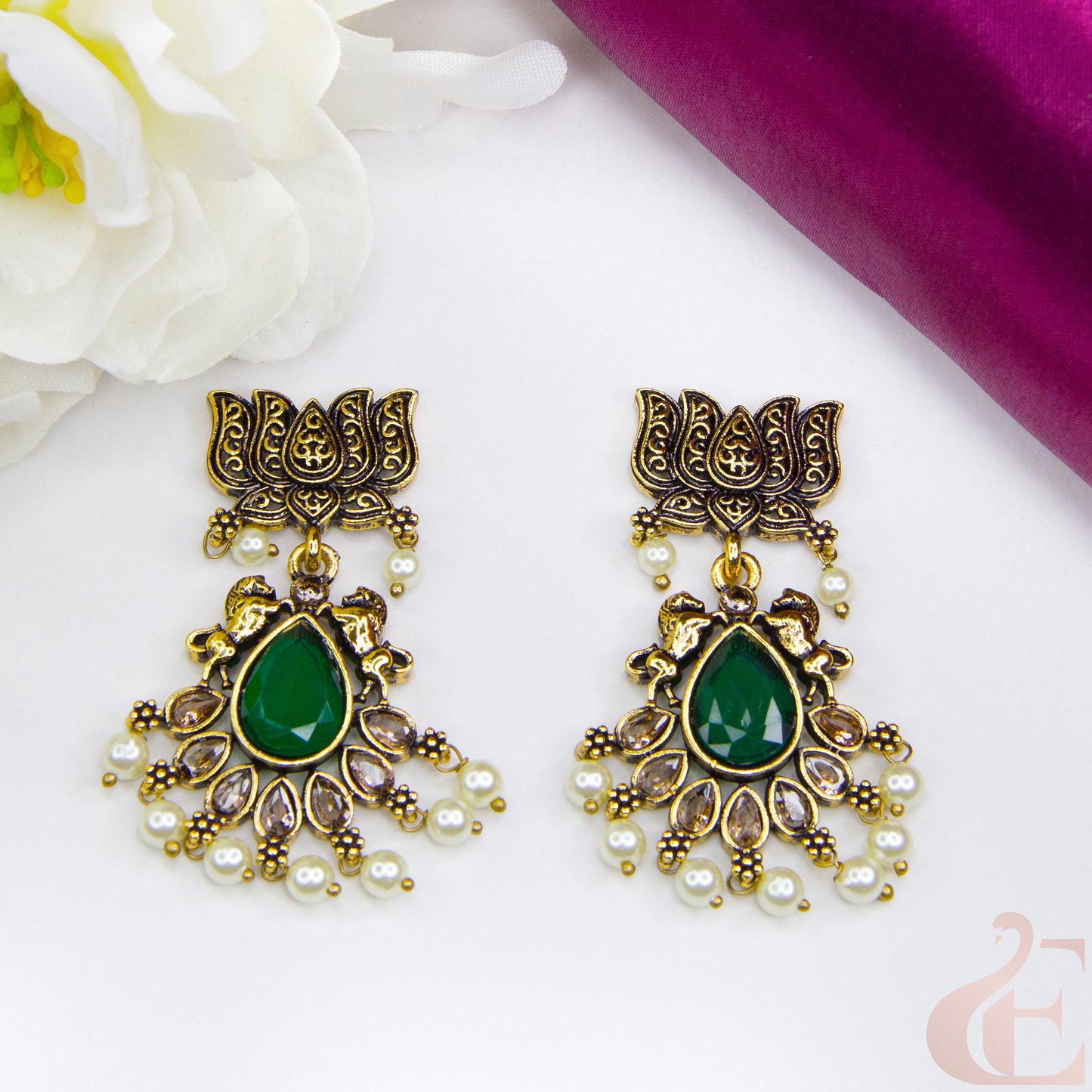 Top view of Mehndi finish lotus & horse designed earrings Green Stone 