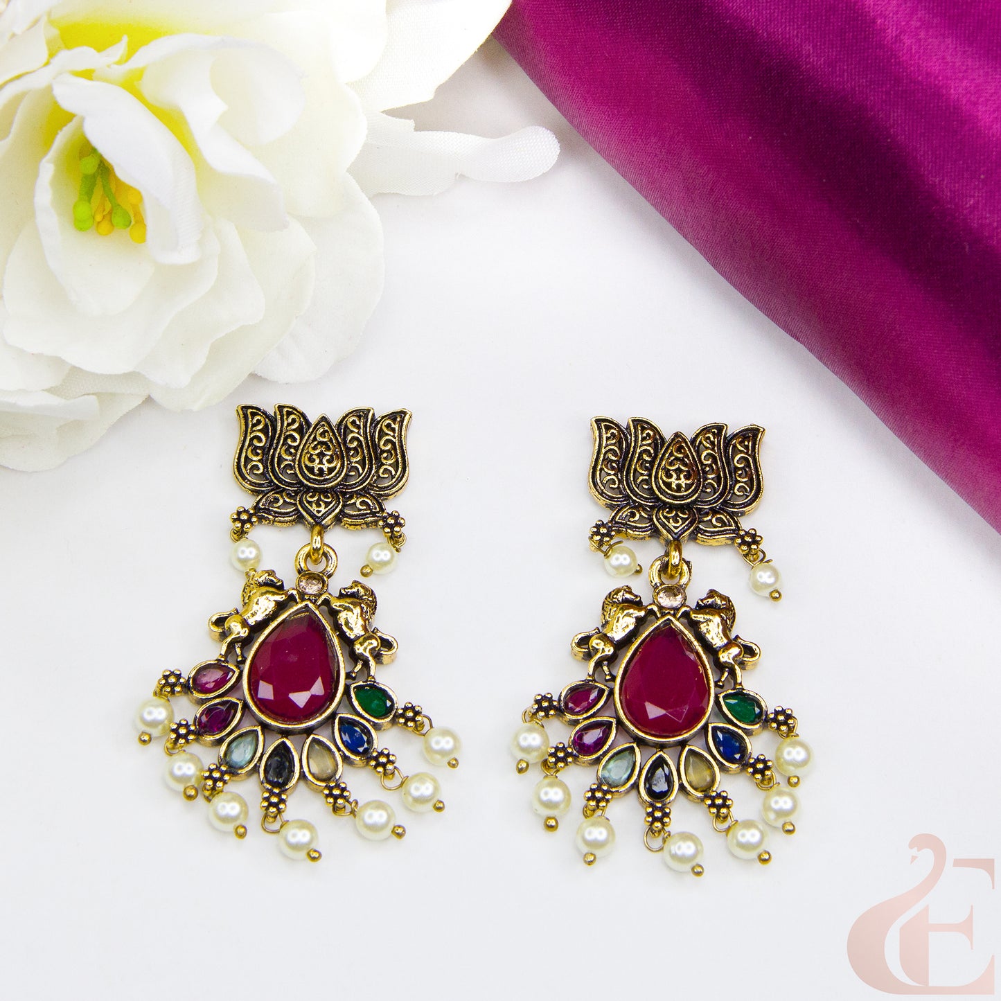 Top view of Mehndi finish lotus & horse designed earrings Multi color Stone 