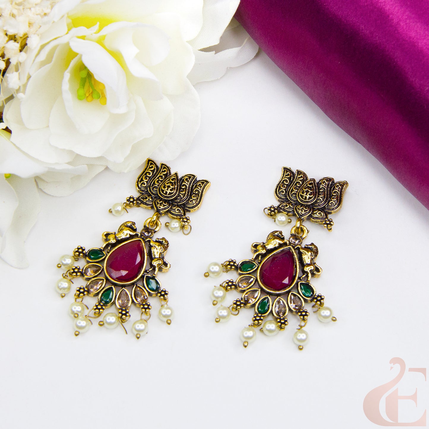 Top view of Mehndi finish lotus & horse designed earrings Ruby Green Stone 