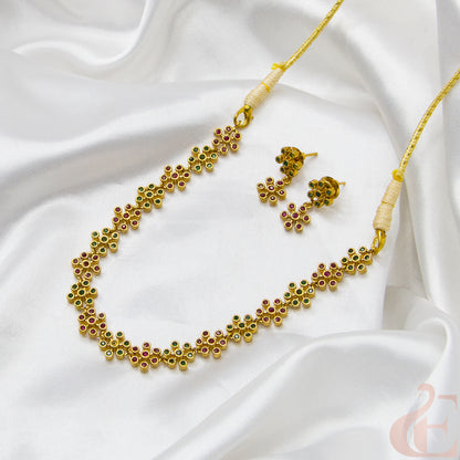 Top view of Premium AD Gold Finish Necklace & Earrings ruby green stones