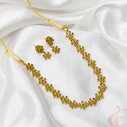 Top view of Premium AD Gold Finish Necklace & Earrings ruby green stones 