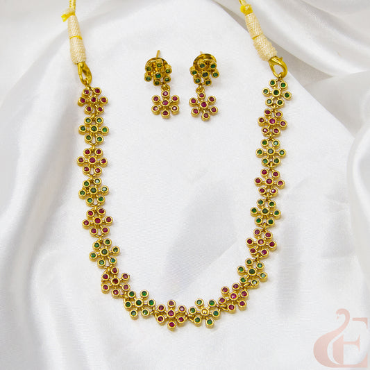 Top view of Premium AD Gold Finish Necklace & Earrings ruby green stones