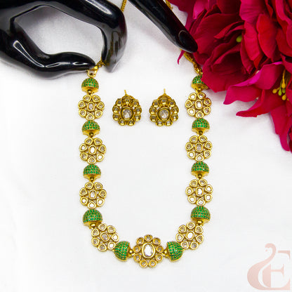 Top view of Premium AD Gold Finish Necklace & Earrings Green Stones 