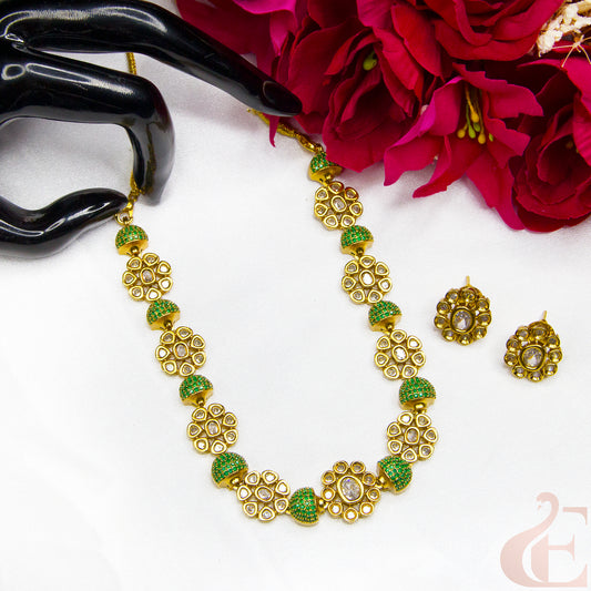 Top view of Premium AD Gold Finish Necklace & Earrings Green stones