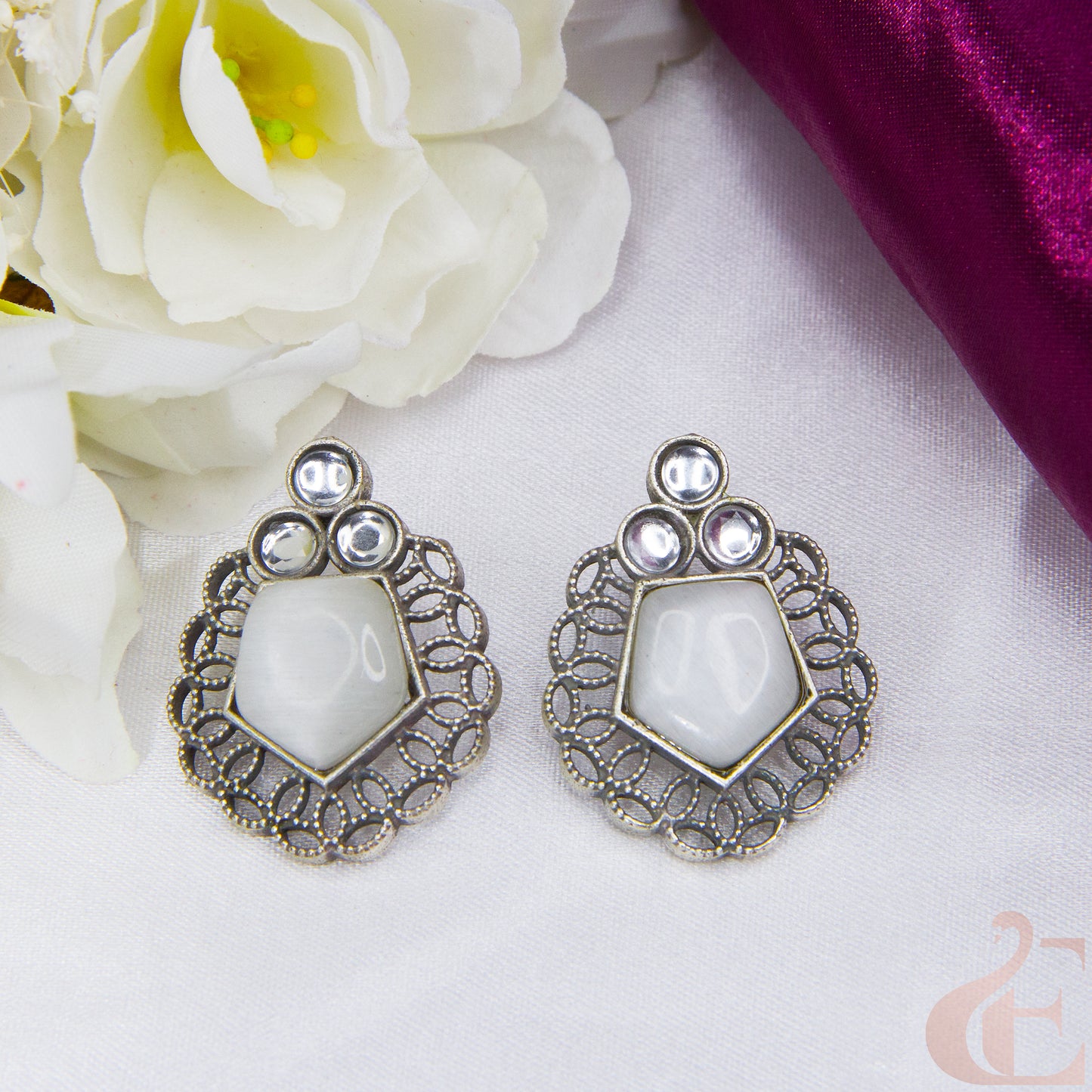 Front view of Premium Silver Replica Earrings off white stone 