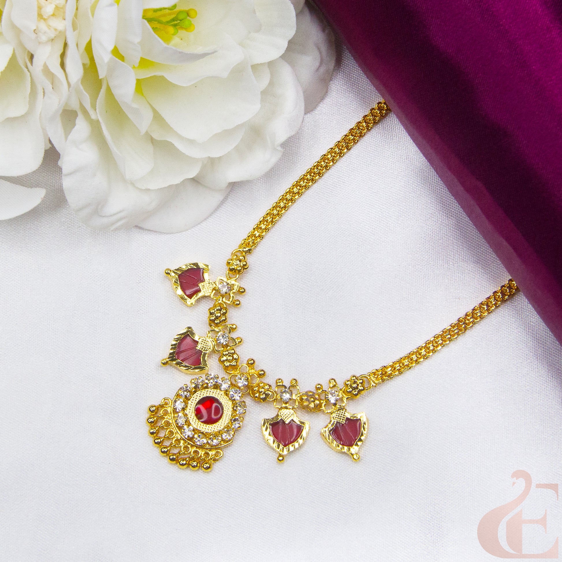 Top view of Traditional Palakka Necklace Red Stones and small white stones 