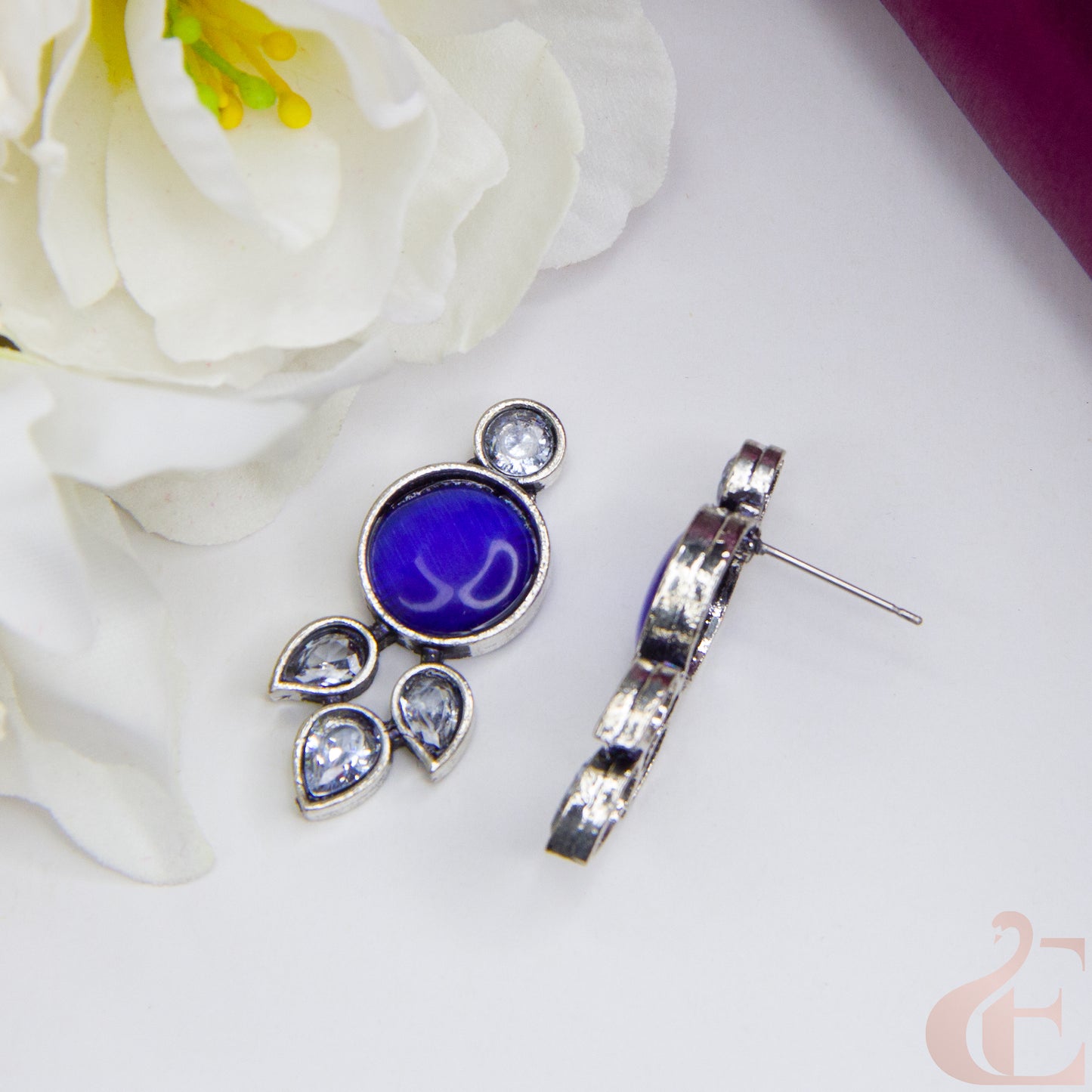 Top side angle view of Trendy Oxidized Silver Earring Blue and white Stone 