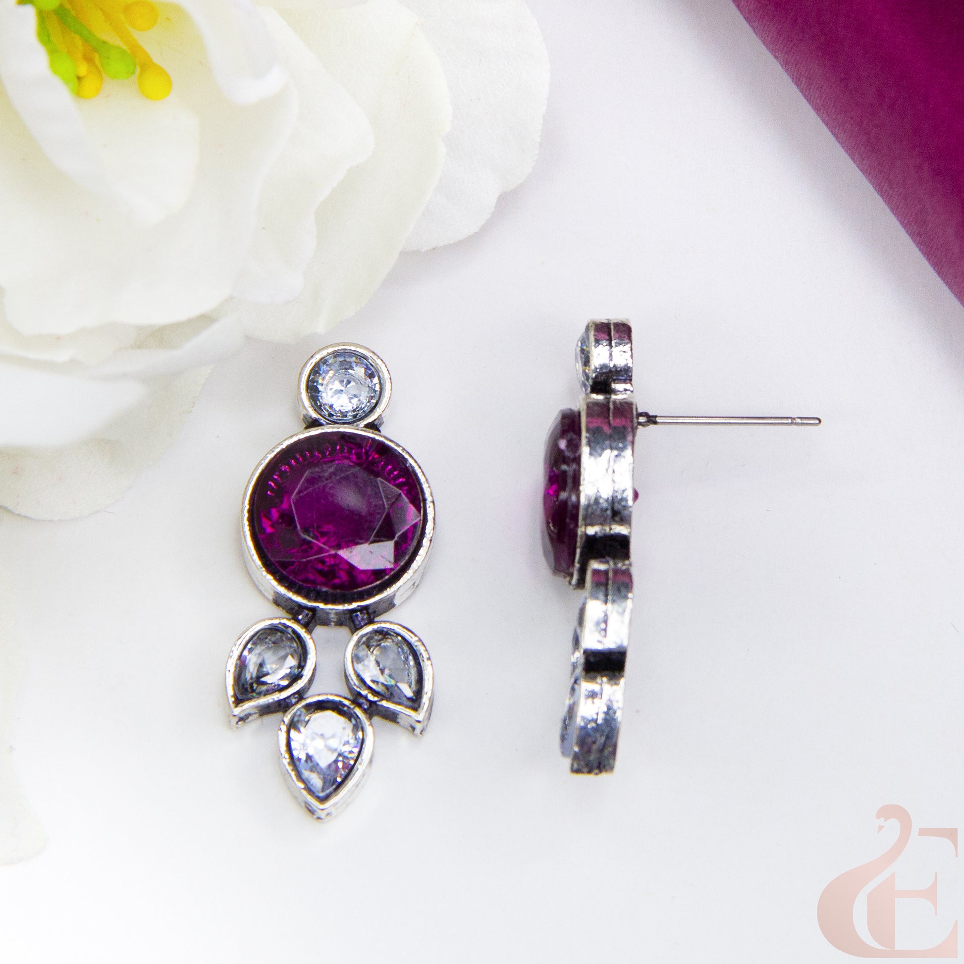 Top side angle view of Trendy Oxidized Silver Earring rani pink & white Stone. 